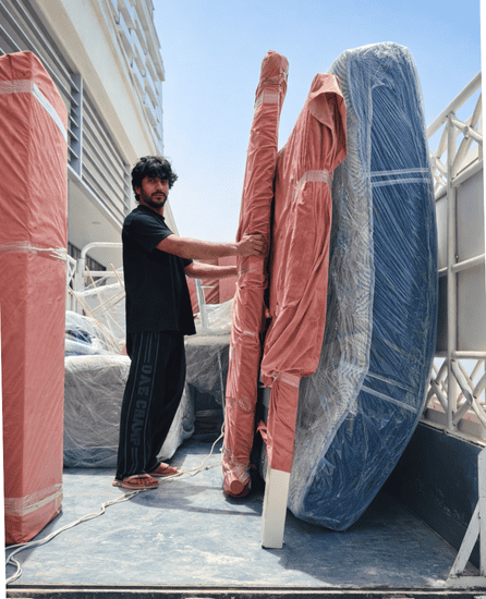 Experienced movers in Ras Al Khaimah safely handling furniture and packing items