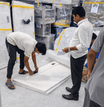 Professional furniture movers in Ras Al Khaimah packing matresses with care